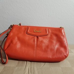Coach orange wristlet clutch